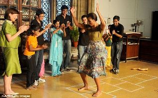 Michelle Obama dancing with kids from Make a Difference program.