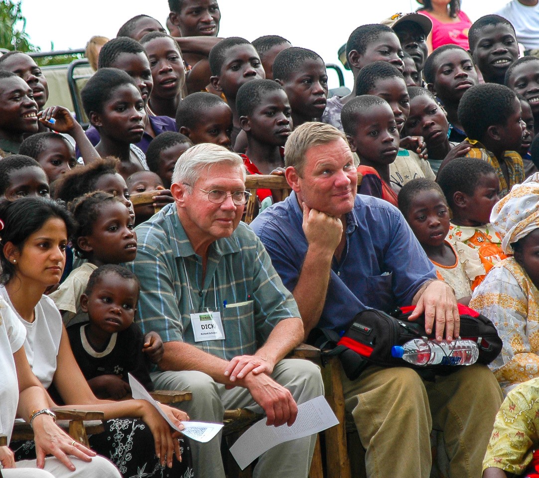 Dick Schubert (left) and Rick Little (right) connecting with youth in a Zambian village.
