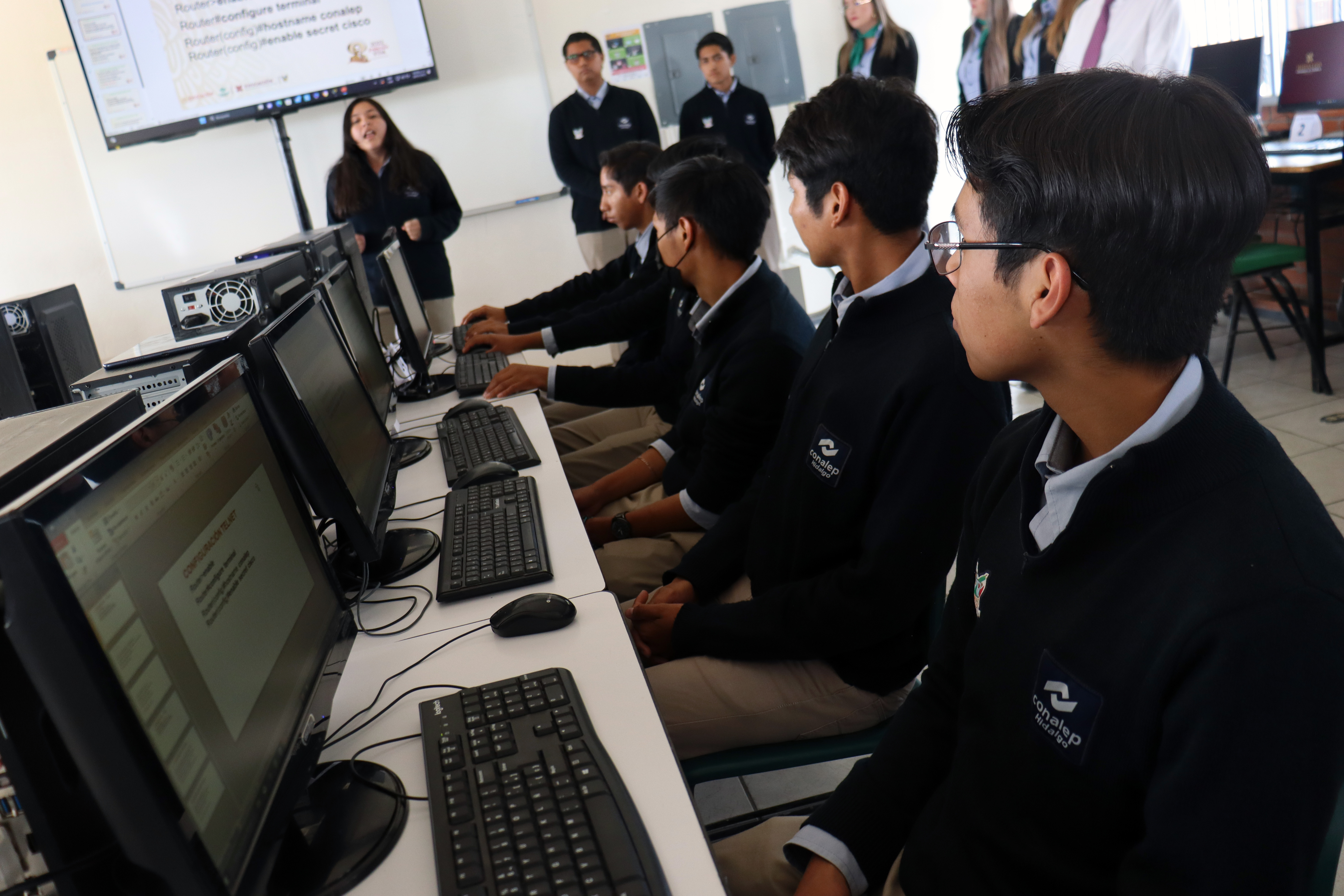 Young people in front of laptop
