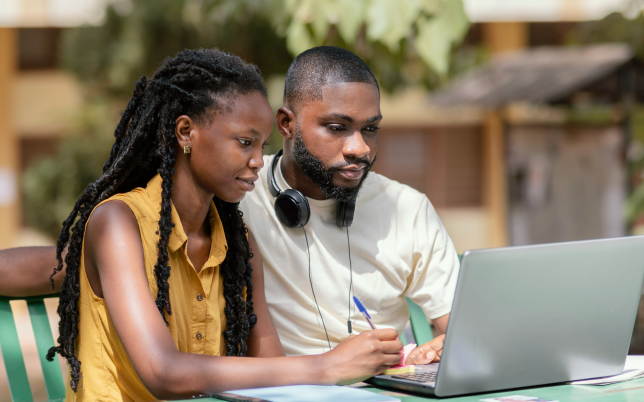 Man and woman in photo with laptop