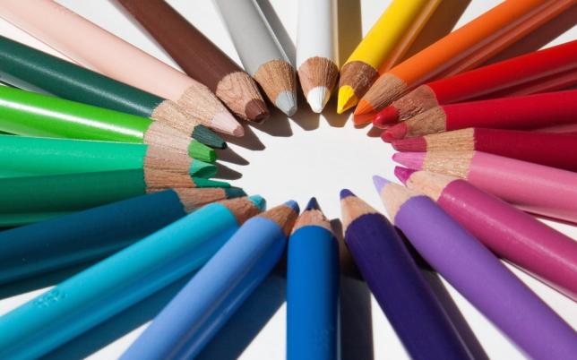 Colorful pencils arranged in a circle, tips pointing inward