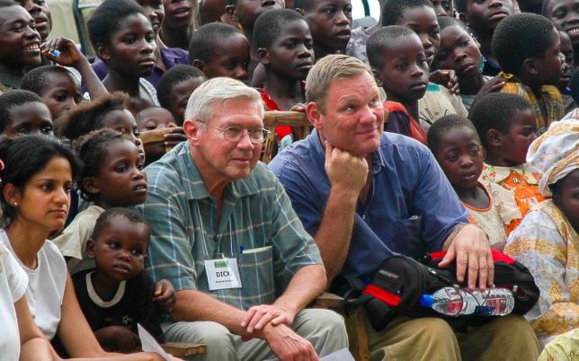 Dick Schubert (left) and Rick Little (right) connecting with youth in a Zambian village.
