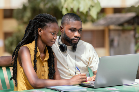 Man and woman in photo with laptop